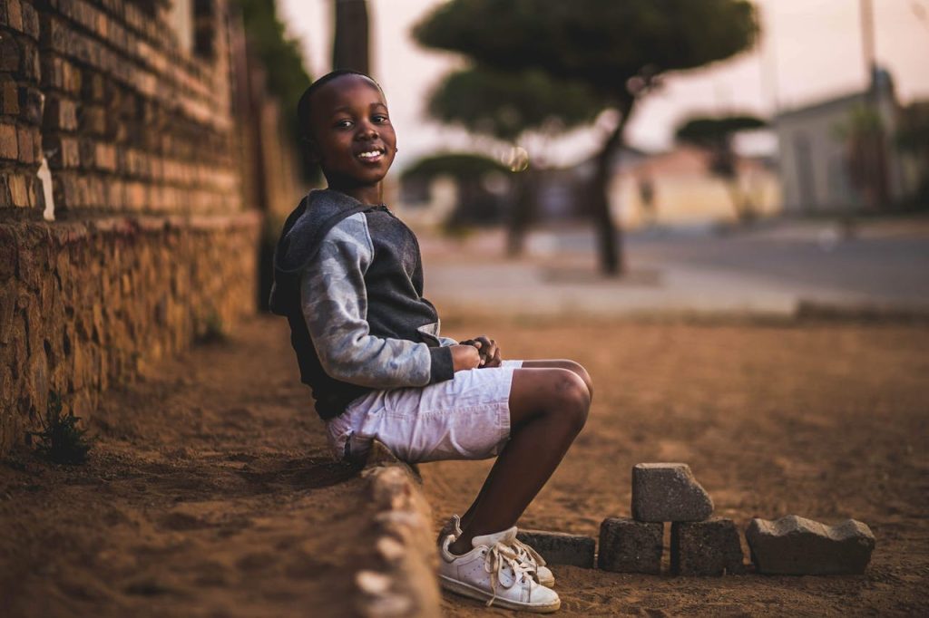 pexels-photo-3177662 Boy Sitting on Dirt
